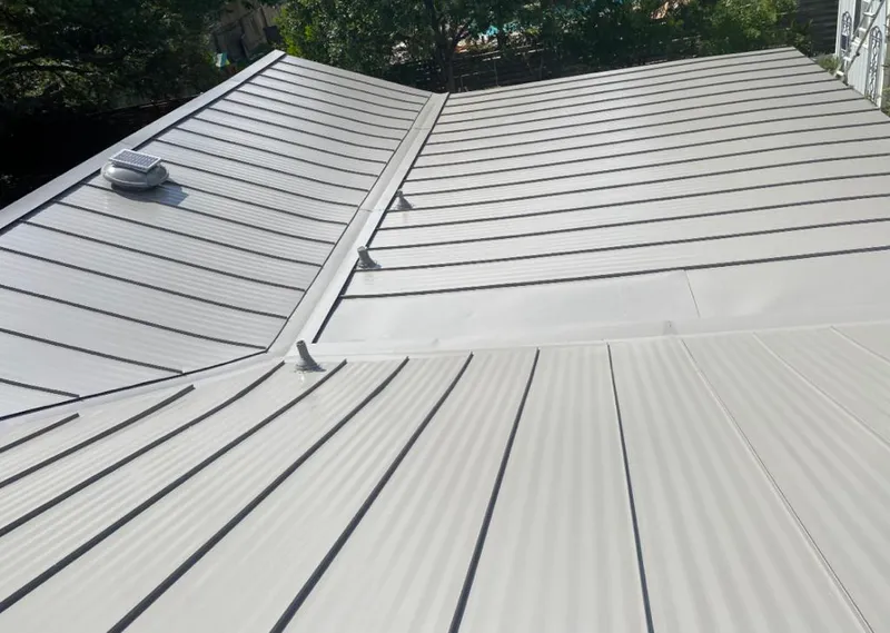 Solar attic fan installed on a metal roof for Roof Ventilation in Lodi
